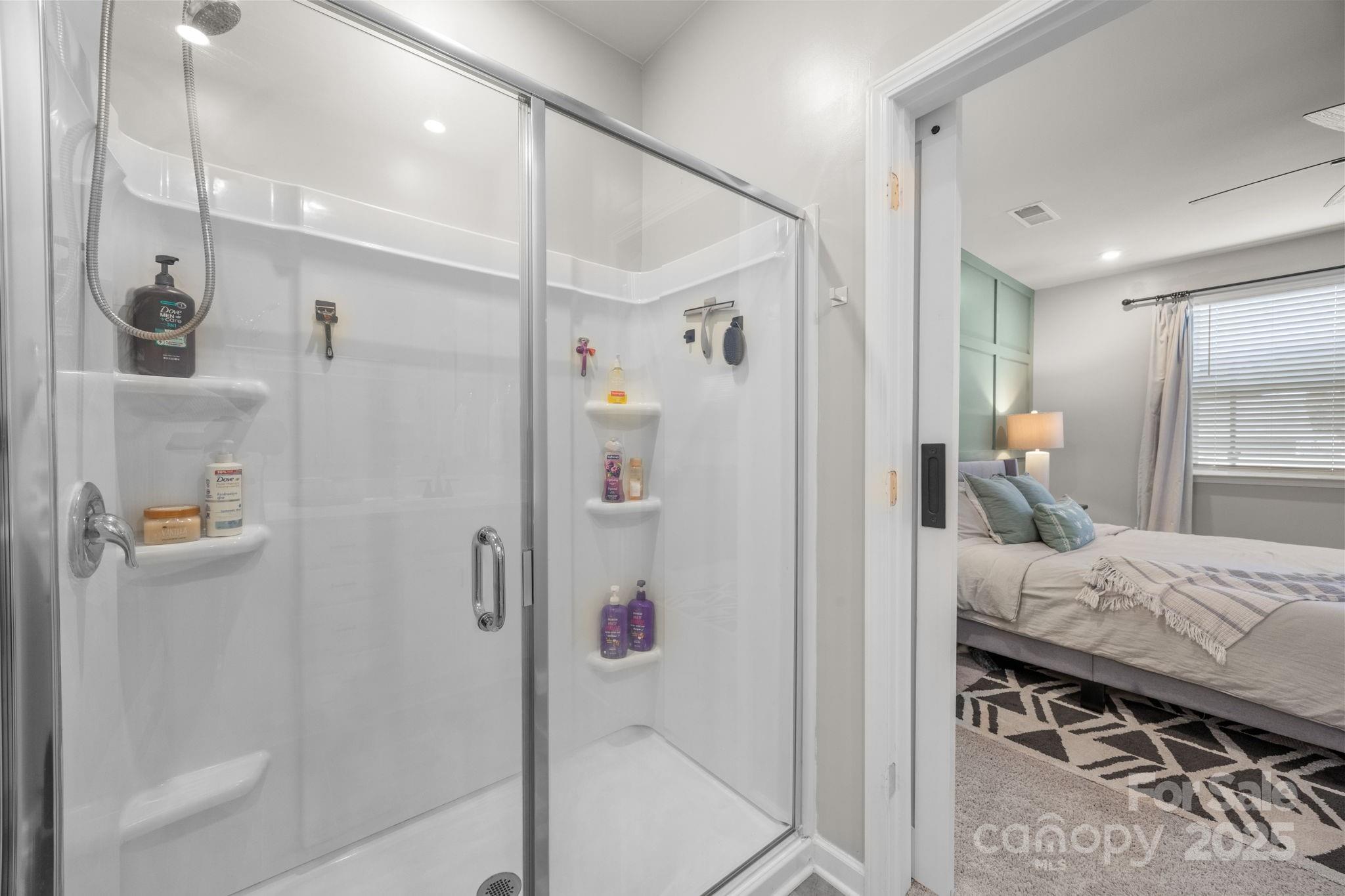 567 Sitka Drive York, SC 29745 - Photo 20 of 40 a bedroom with a bed and a mirror