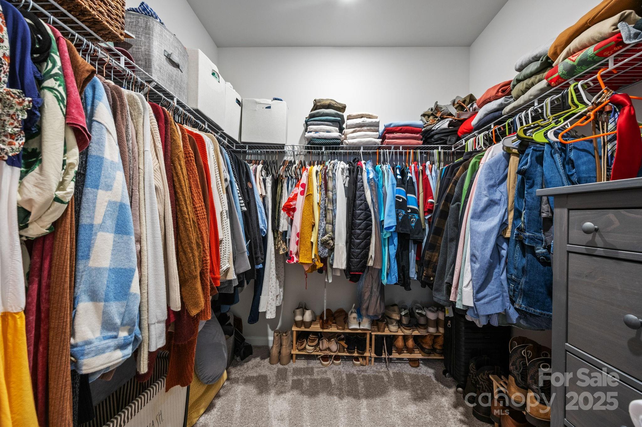 567 Sitka Drive York, SC 29745 - Photo 21 of 40 a view of walk in closet with clothes and shoes