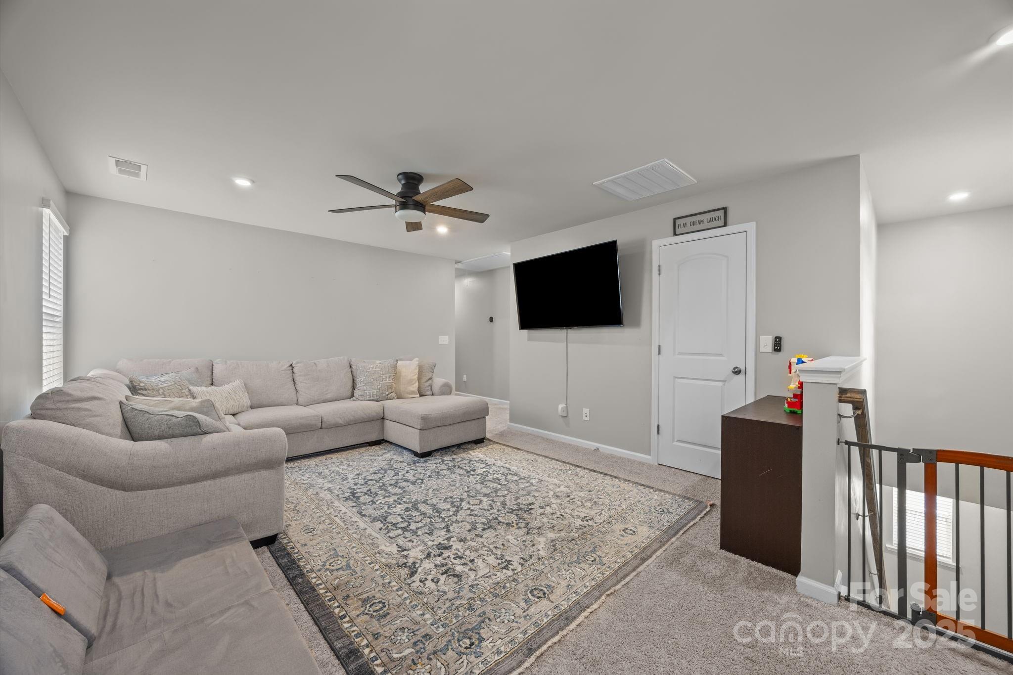 567 Sitka Drive York, SC 29745 - Photo 24 of 40 a living room with furniture and a flat screen tv