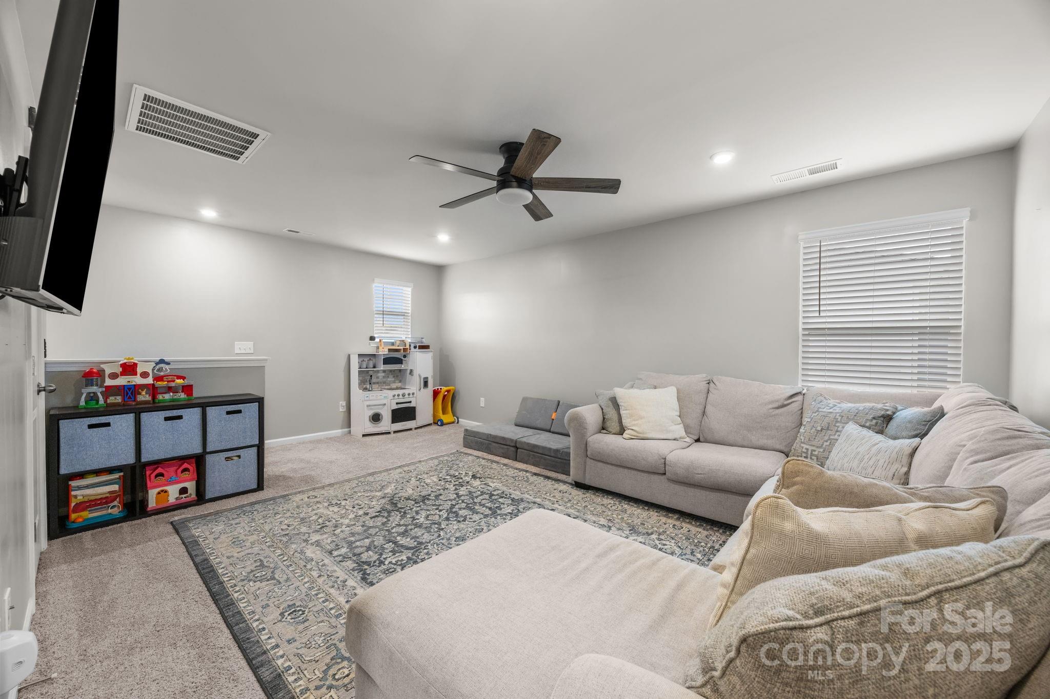 567 Sitka Drive York, SC 29745 - Photo 25 of 40 a living room with furniture and a flat screen tv