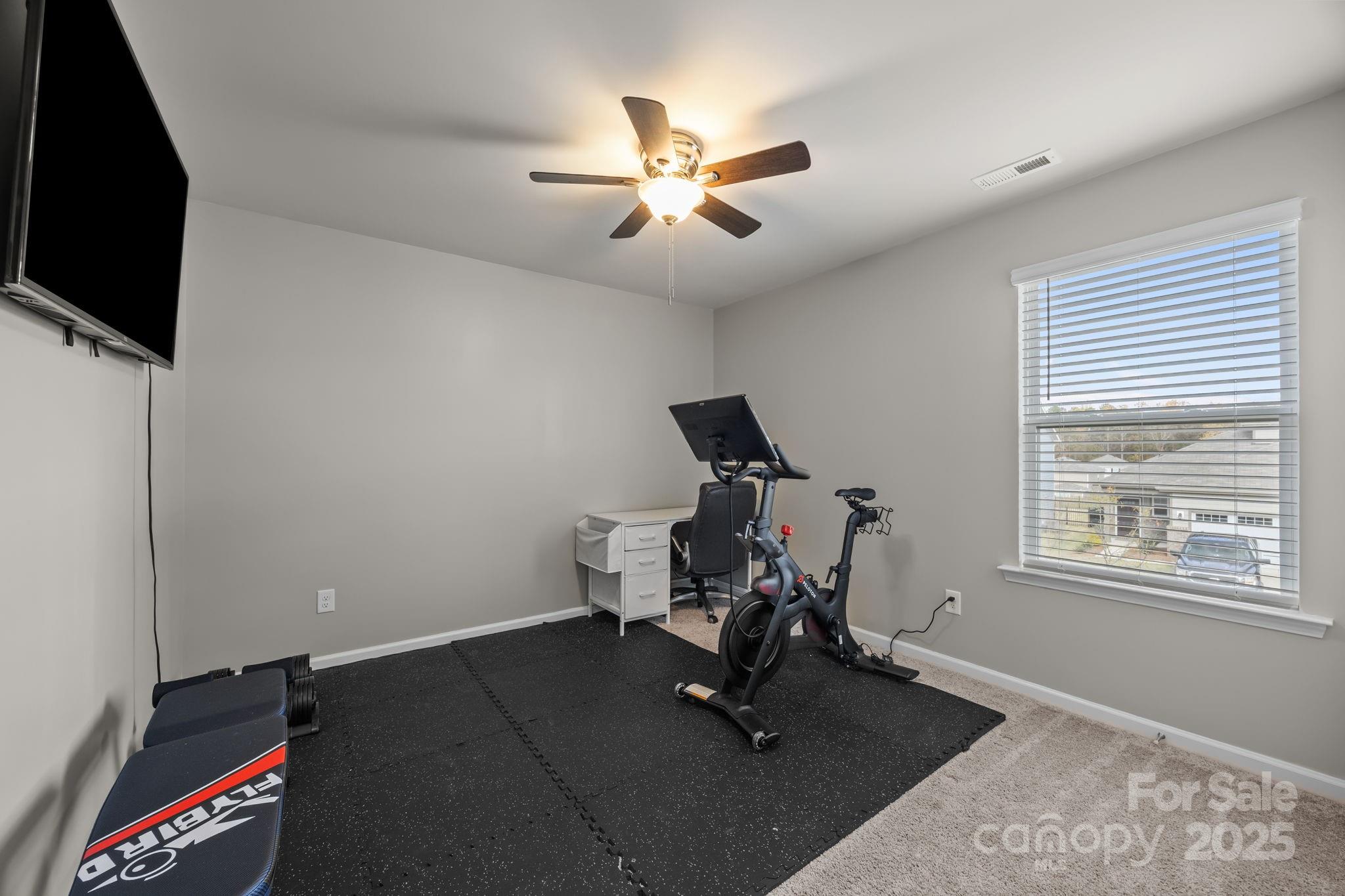 567 Sitka Drive York, SC 29745 - Photo 28 of 40 a room with gym equipment and windows