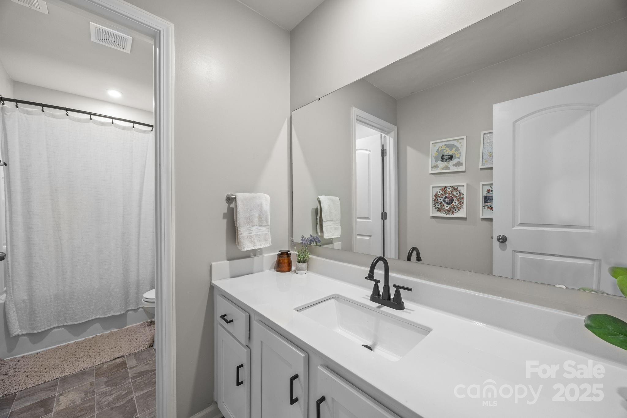 567 Sitka Drive York, SC 29745 - Photo 30 of 40 a bathroom with a double vanity sink and a mirror