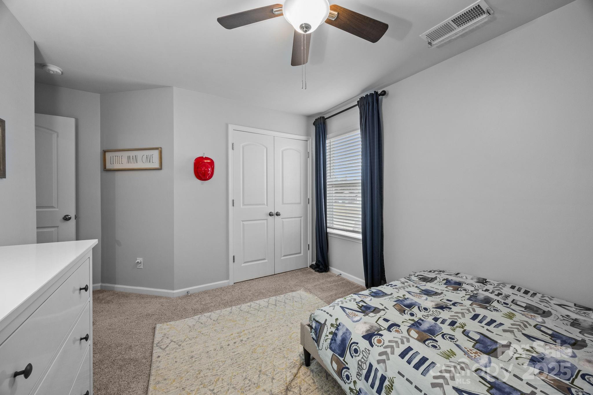 567 Sitka Drive York, SC 29745 - Photo 32 of 40 a bedroom with a bed and a dresser