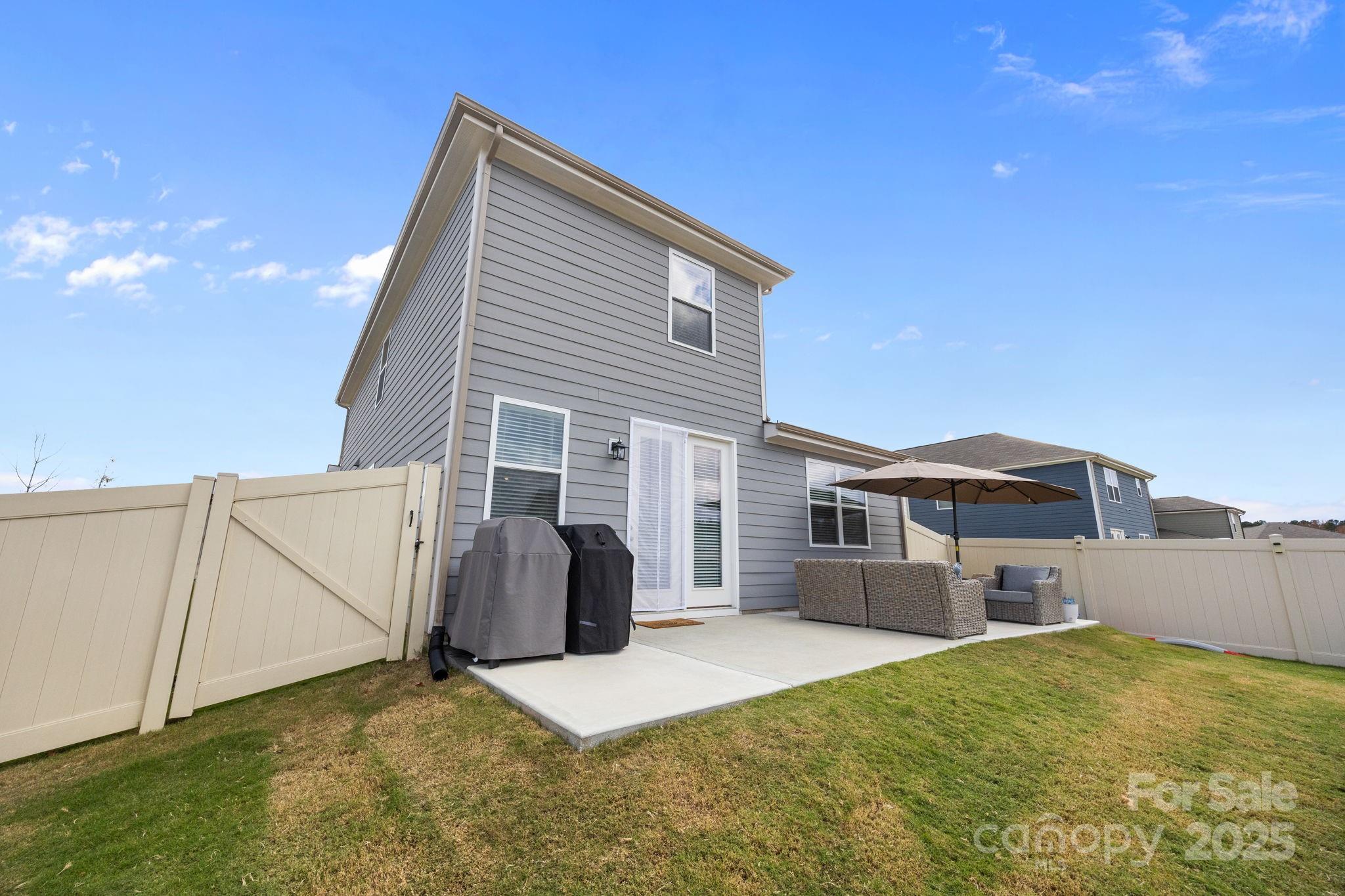567 Sitka Drive York, SC 29745 - Photo 35 of 40 a view of a house with backyard and a tree