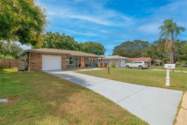 a view of house with outdoor space and swimming pool