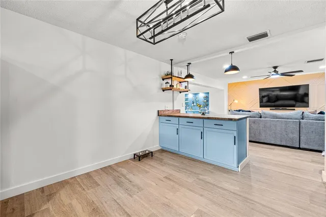 a kitchen with stainless steel appliances a sink and cabinets