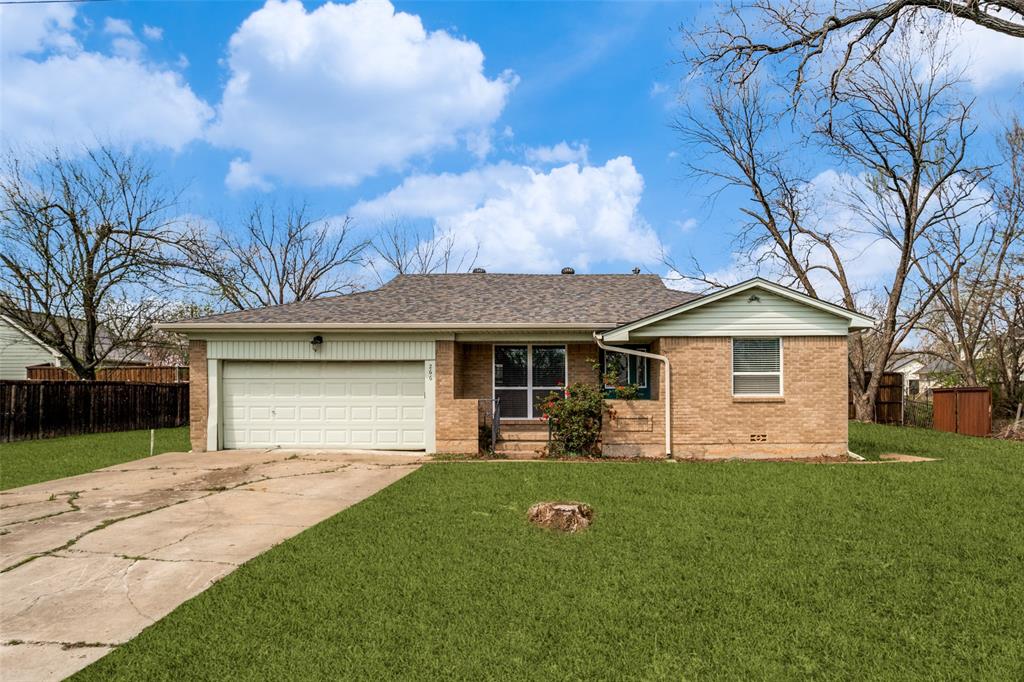 Single story home featuring brick siding, a garage, driveway, roof with shingles, and crawl space