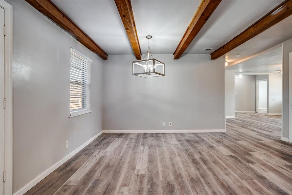 266 West Fulton Street Van Alstyne, TX 75495 - Photo 5 of 13 a view of room with window and wooden floor