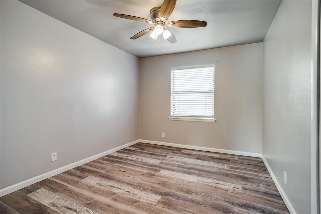 266 West Fulton Street Van Alstyne, TX 75495 - Photo 7 of 13 a view of a room with a ceiling fan and a window