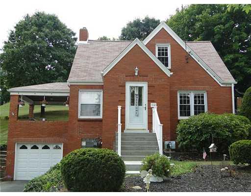 16 Belgium Hill Road Cecil, PA 15321 - Photo 1 of 18 a front view of a house with a yard