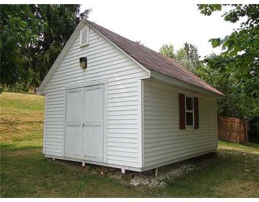 16 Belgium Hill Road Cecil, PA 15321 - Photo 17 of 18 a view of a small house with backyard
