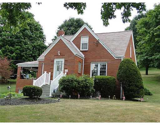 16 Belgium Hill Road Cecil, PA 15321 - Photo 2 of 18 a front view of a house with a yard and plants