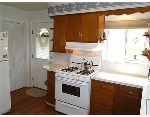 16 Belgium Hill Road Cecil, PA 15321 - Photo 7 of 18 a kitchen with a stove a sink and a window