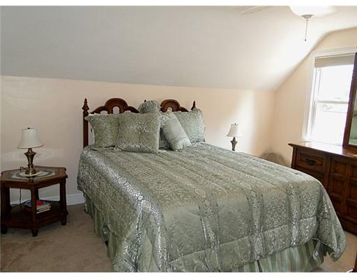 16 Belgium Hill Road Cecil, PA 15321 - Photo 8 of 18 a bedroom with a bed and a table in it