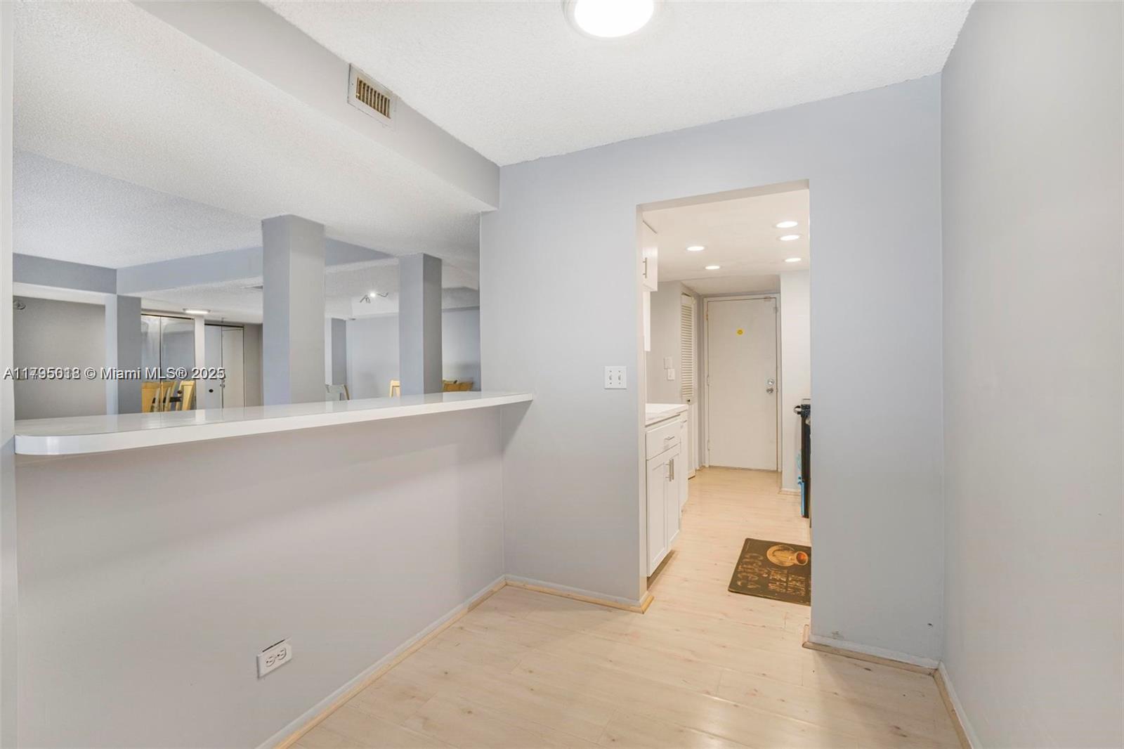 3650 Inverrary Drive, Unit 3P Lauderhill, FL 33319 - Photo 13 of 40 a view of a kitchen with a sink and a cabinet