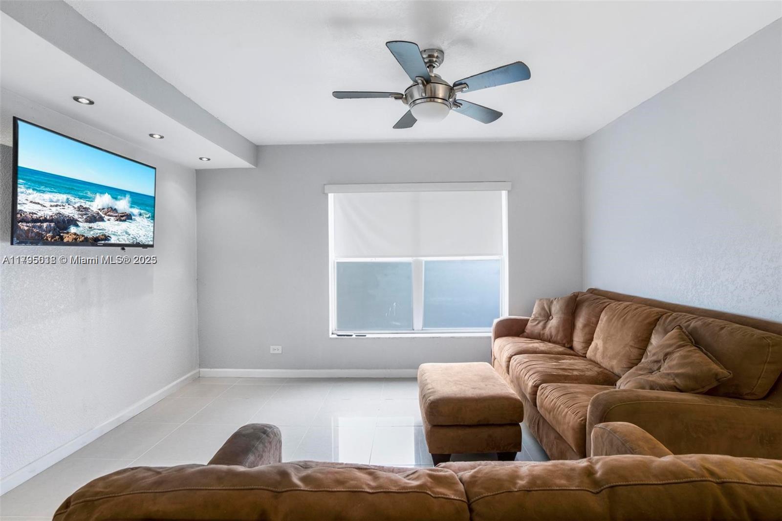 3650 Inverrary Drive, Unit 3P Lauderhill, FL 33319 - Photo 16 of 40 a living room with furniture and a window