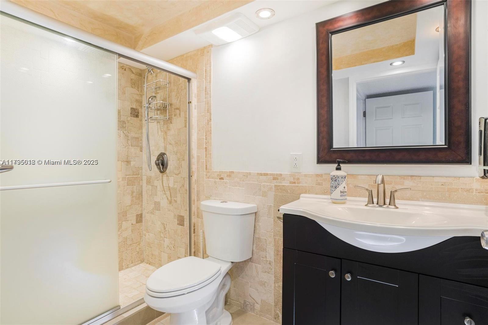 3650 Inverrary Drive, Unit 3P Lauderhill, FL 33319 - Photo 19 of 40 a bathroom with a sink a toilet and shower