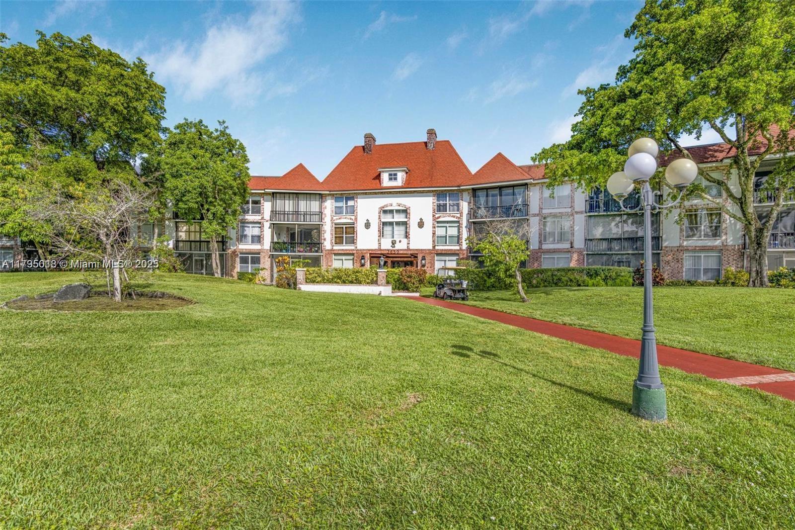 3650 Inverrary Drive, Unit 3P Lauderhill, FL 33319 - Photo 3 of 40 a view of a house with a yard