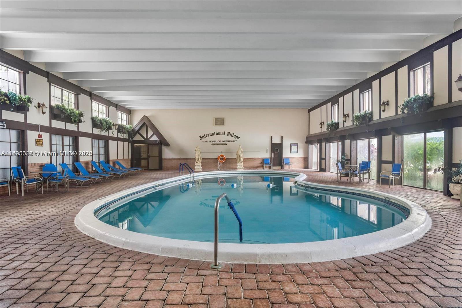 3650 Inverrary Drive, Unit 3P Lauderhill, FL 33319 - Photo 31 of 40 a view of a swimming pool with seating space
