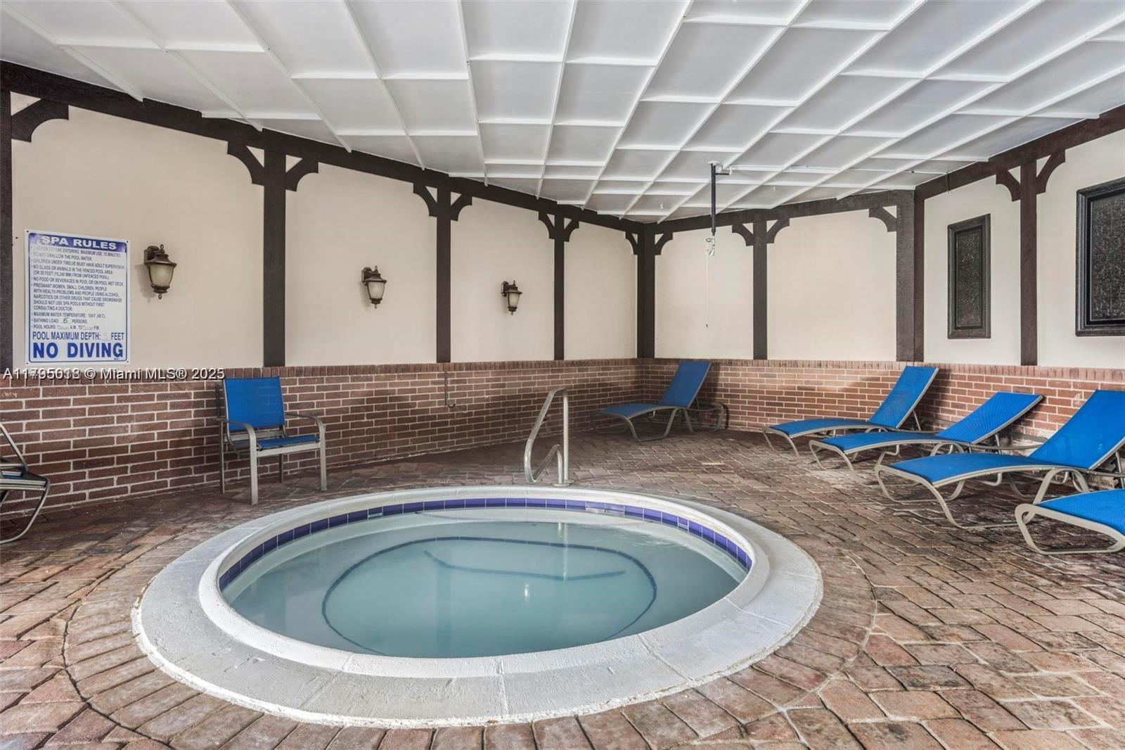 3650 Inverrary Drive, Unit 3P Lauderhill, FL 33319 - Photo 32 of 40 a room with wooden floor and furniture