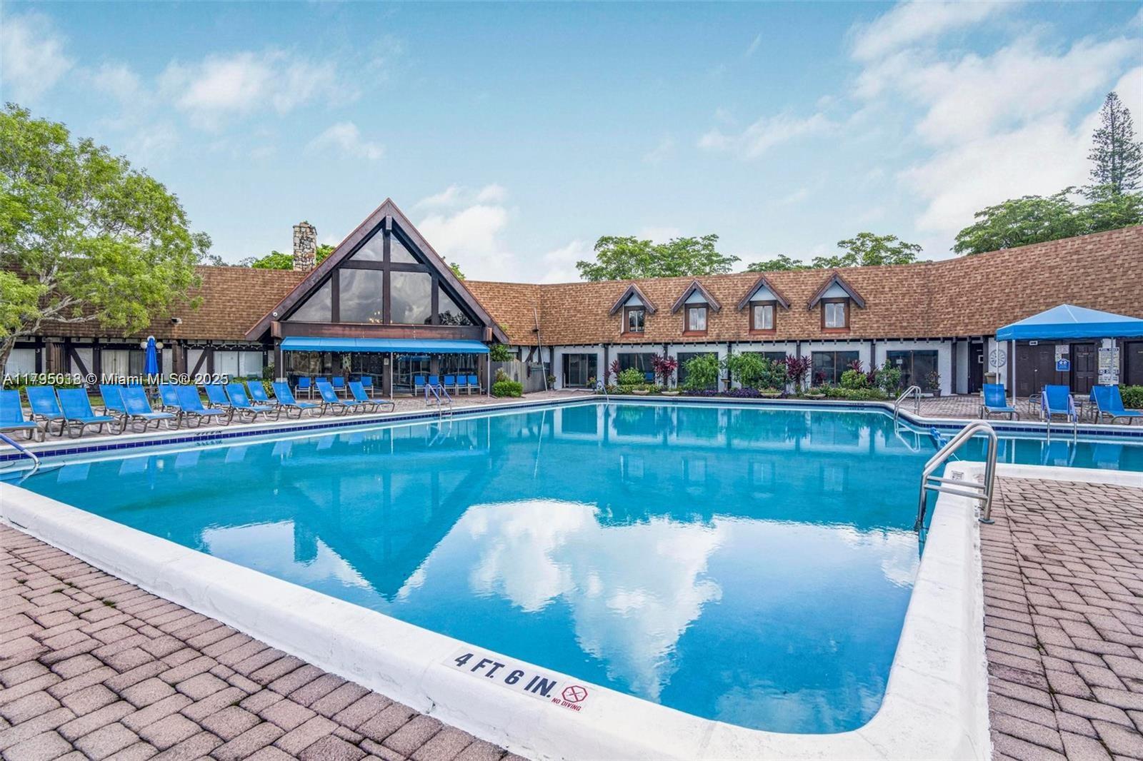 3650 Inverrary Drive, Unit 3P Lauderhill, FL 33319 - Photo 34 of 40 a view of a house with a swimming pool