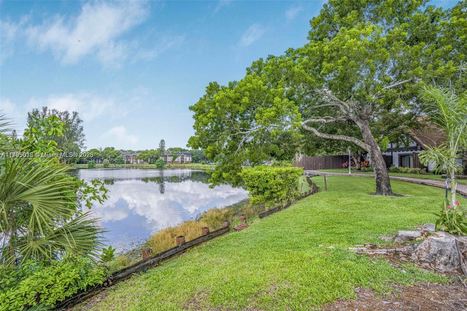 3650 Inverrary Drive, Unit 3P Lauderhill, FL 33319 - Photo 36 of 40 a view of a lake with a yard