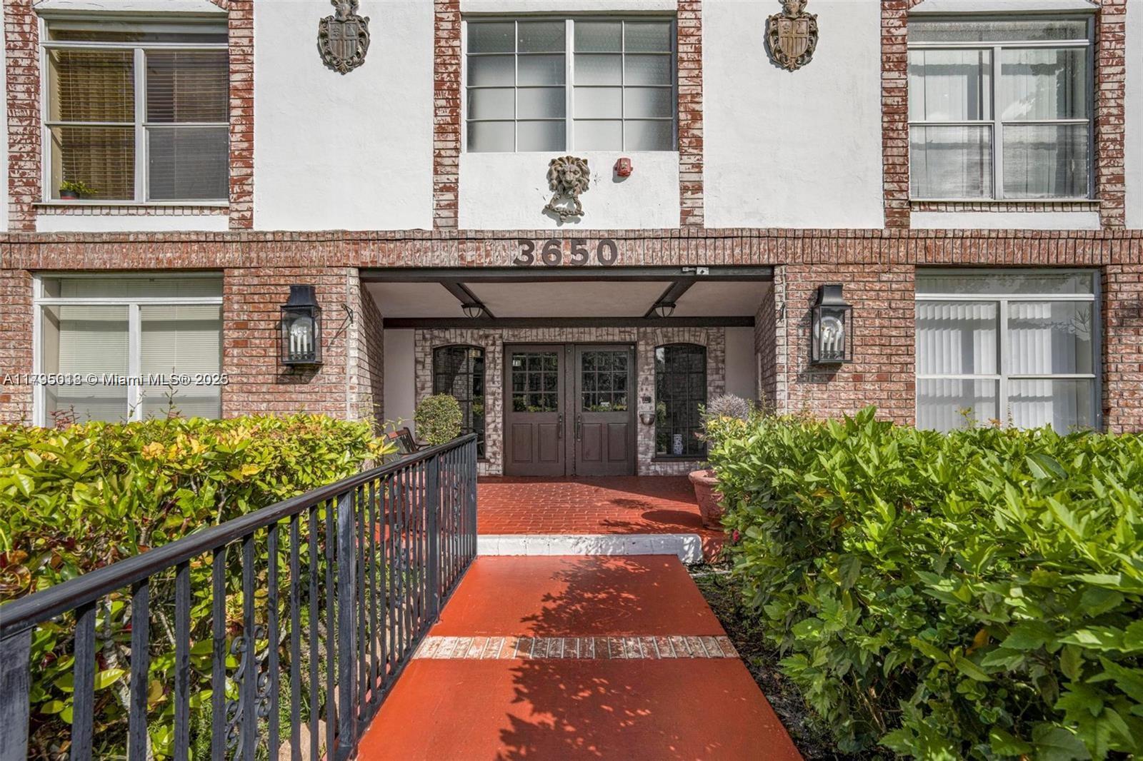 3650 Inverrary Drive, Unit 3P Lauderhill, FL 33319 - Photo 4 of 40 a front view of a house with a garden