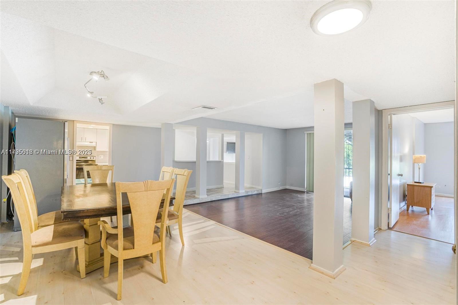 3650 Inverrary Drive, Unit 3P Lauderhill, FL 33319 - Photo 6 of 40 a view of a dining room with furniture and wooden floor