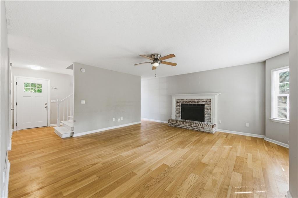 5017 Sandyhook Court Northwest Acworth, GA 30102 - Photo 15 of 43 a view of an empty room with a fireplace and a window