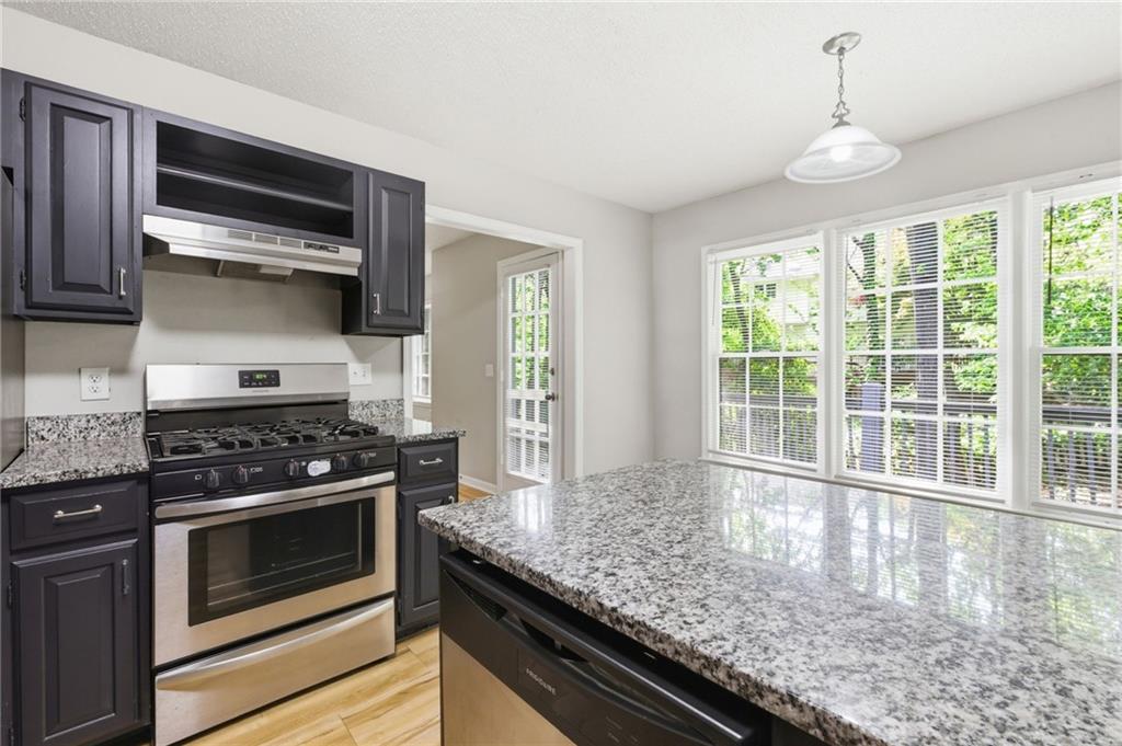 5017 Sandyhook Court Northwest Acworth, GA 30102 - Photo 22 of 43 a kitchen with a stove and a sink