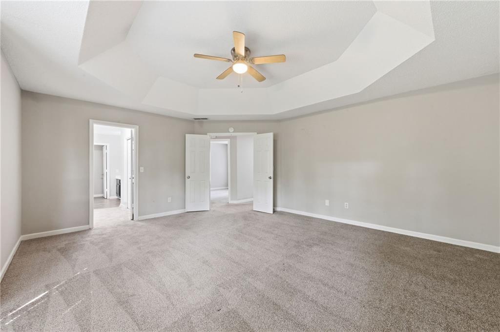 5017 Sandyhook Court Northwest Acworth, GA 30102 - Photo 30 of 43 a view of an empty room with a ceiling fan