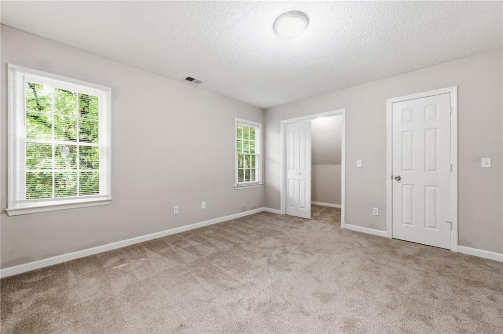 5017 Sandyhook Court Northwest Acworth, GA 30102 - Photo 35 of 43 an empty room with windows