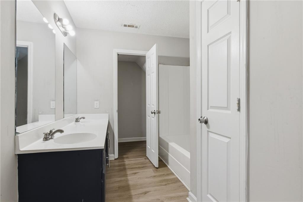 5017 Sandyhook Court Northwest Acworth, GA 30102 - Photo 36 of 43 a bathroom with a sink and a mirror