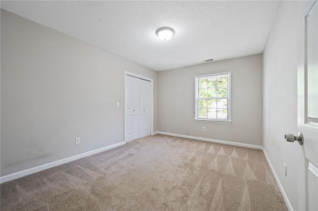 5017 Sandyhook Court Northwest Acworth, GA 30102 - Photo 37 of 43 an empty room with windows