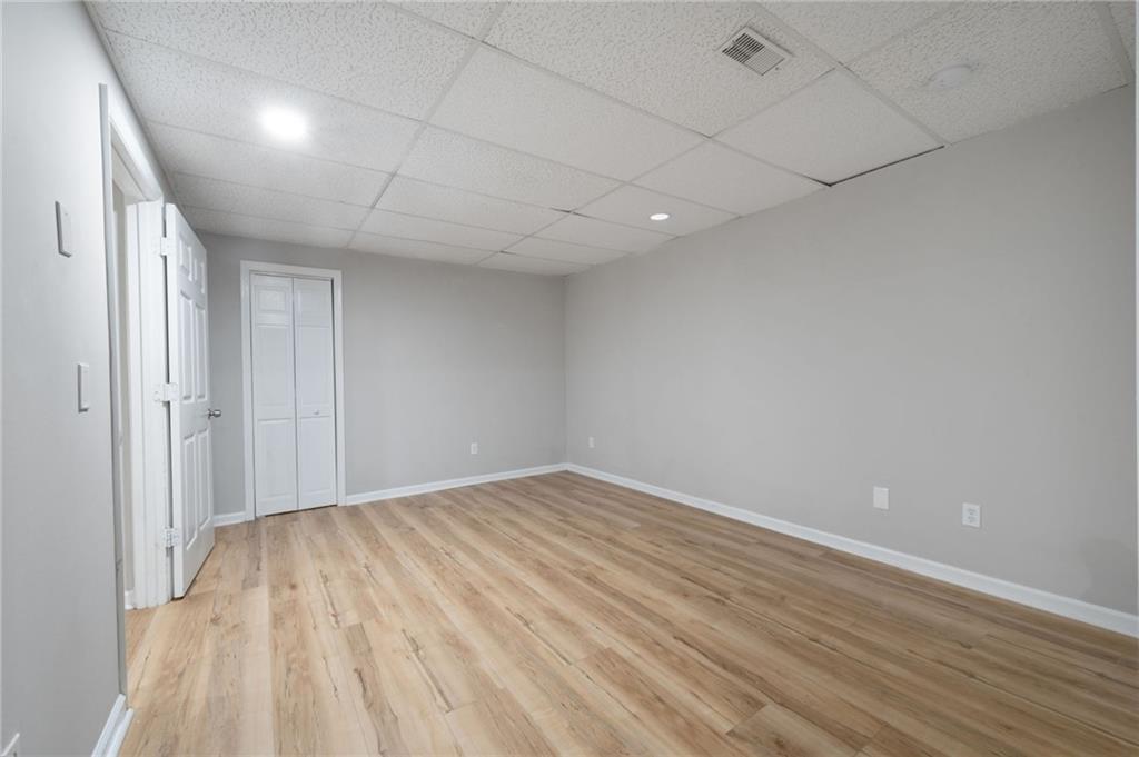 5017 Sandyhook Court Northwest Acworth, GA 30102 - Photo 39 of 43 a view of empty room with wooden floor