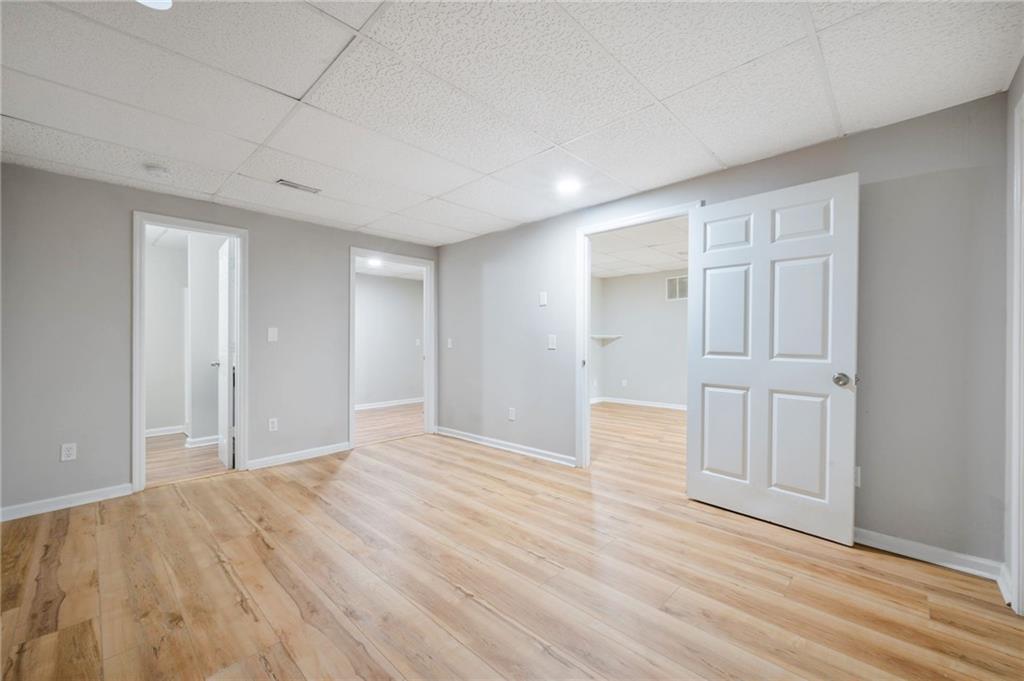 5017 Sandyhook Court Northwest Acworth, GA 30102 - Photo 40 of 43 a view of an empty room with wooden floor