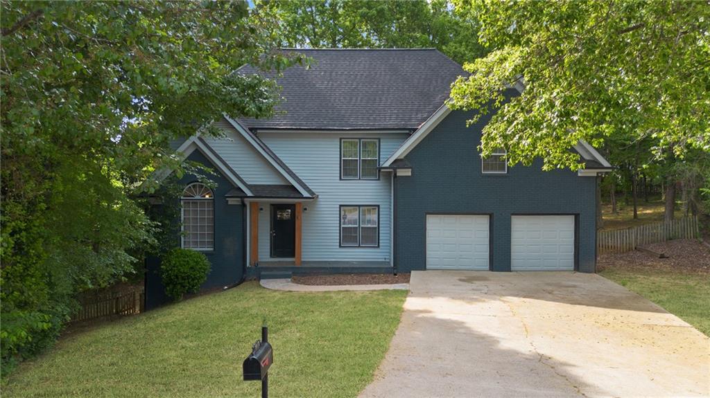 5017 Sandyhook Court Northwest Acworth, GA 30102 - Photo 4 of 43 front view of a house with a yard