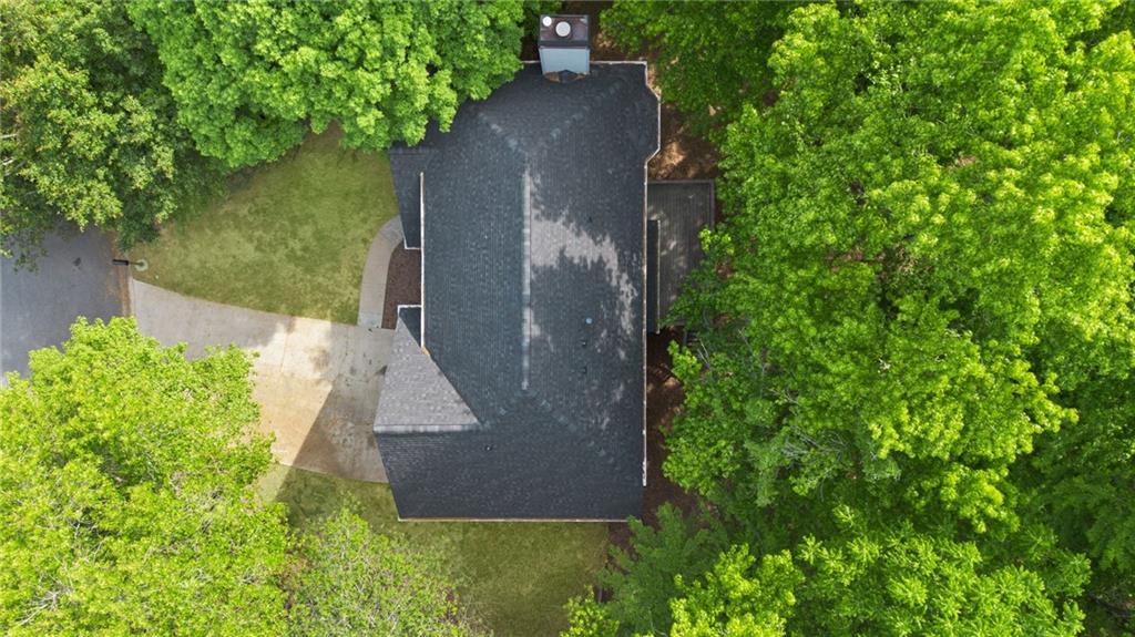 5017 Sandyhook Court Northwest Acworth, GA 30102 - Photo 6 of 43 an aerial view of a house with a yard and large trees