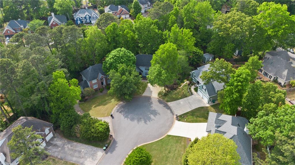 5017 Sandyhook Court Northwest Acworth, GA 30102 - Photo 7 of 43 an aerial view of a house with a yard and trees all around