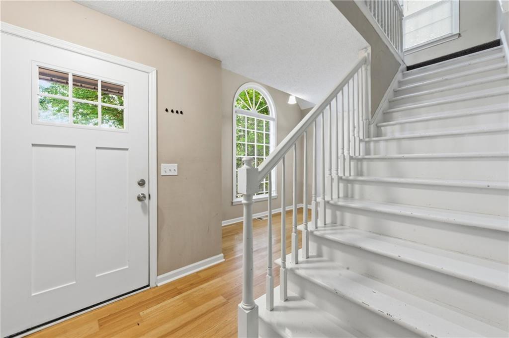 5017 Sandyhook Court Northwest Acworth, GA 30102 - Photo 10 of 43 a view of entryway and hall with wooden floor