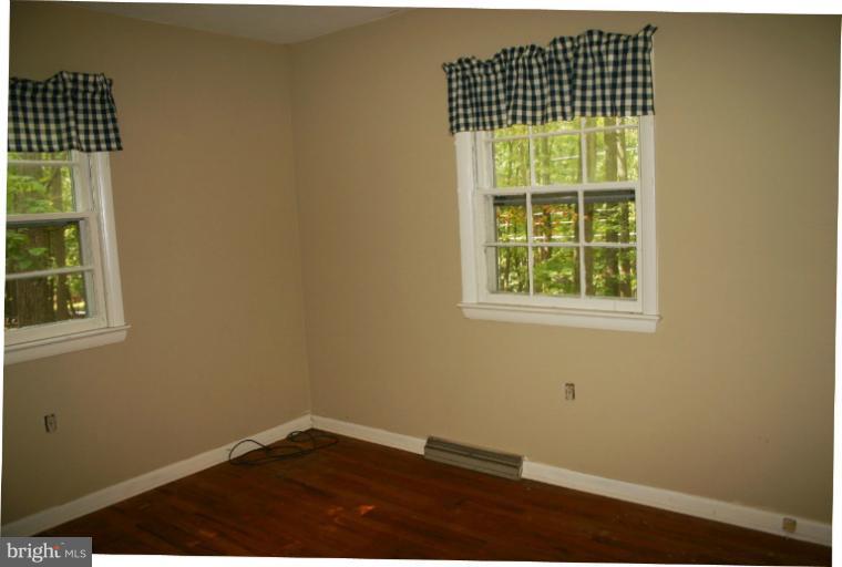 98 Highview Road Harpers Ferry, WV 25425 - Photo 3 of 11 an empty room with a window