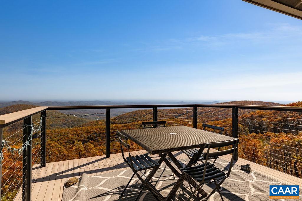 1469 The Ledges Roseland, VA 22967 - Photo 1 of 35 a balcony with table and chairs