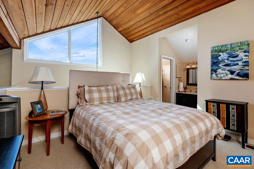 1469 The Ledges Roseland, VA 22967 - Photo 14 of 35 a large bed sitting in a bedroom next to a window