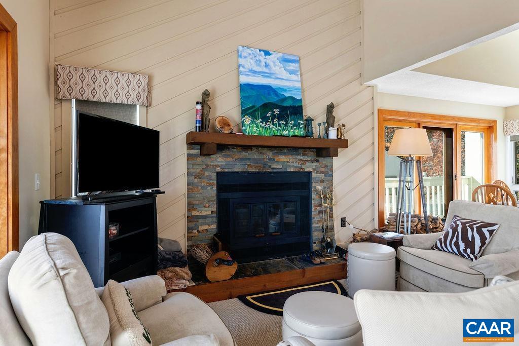 1469 The Ledges Roseland, VA 22967 - Photo 4 of 35 a living room with furniture a flat screen tv and a fireplace