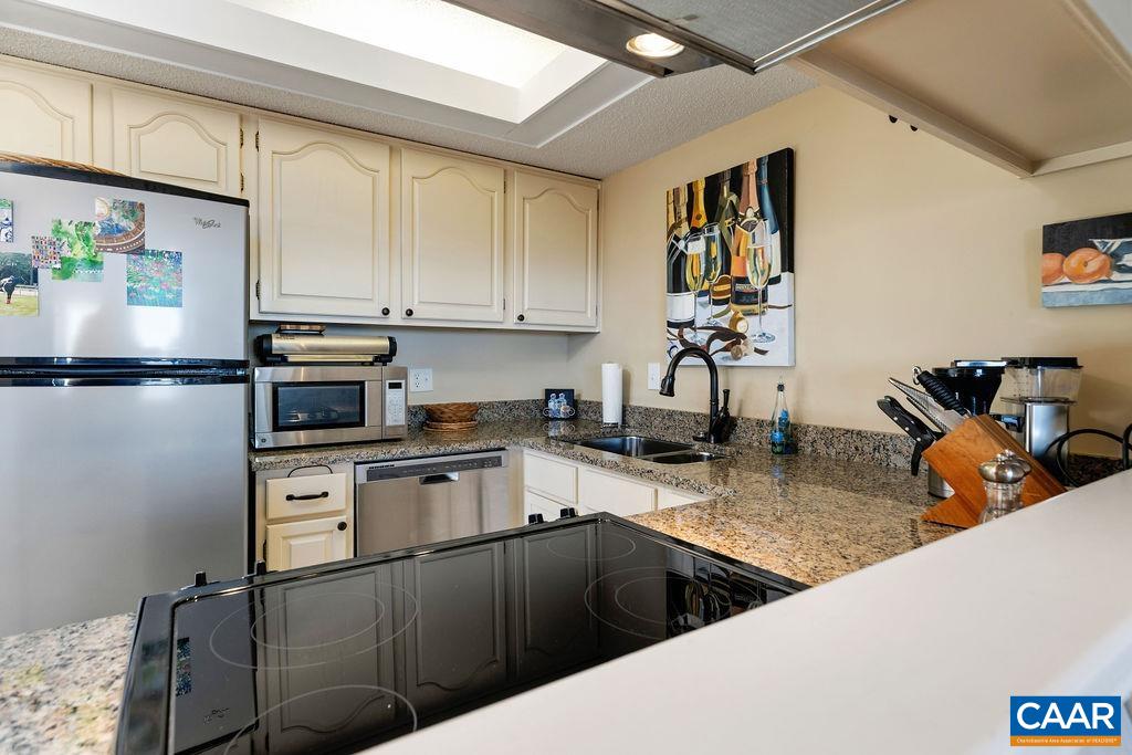 1469 The Ledges Roseland, VA 22967 - Photo 8 of 35 a kitchen with stainless steel appliances granite countertop a sink stove and refrigerator