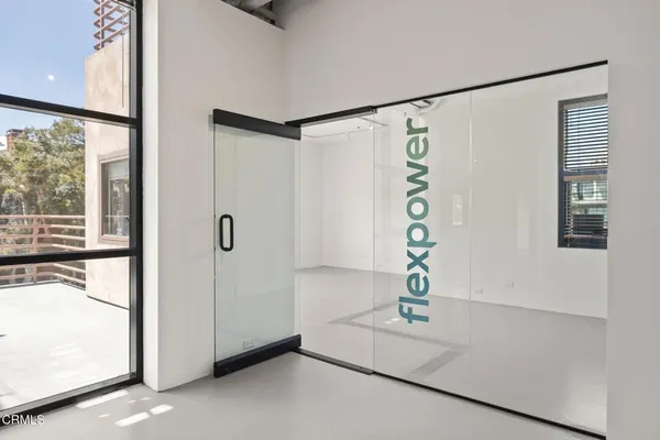 a bathroom with a shower and a window