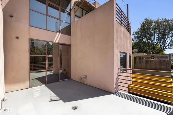 a view of a building with entryway and stairs