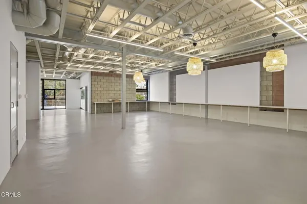 a view of a room with wooden walls