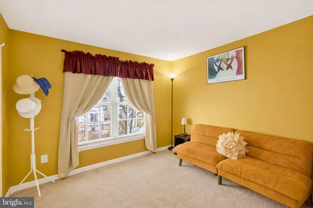 a living room with a couch and a window