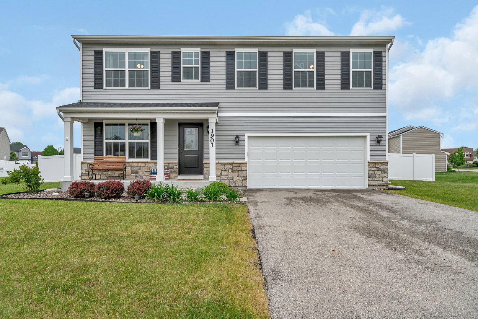 1901 Locust Road Morris, IL 60450 - Photo 30 of 30 a front view of a house with a garden and garage